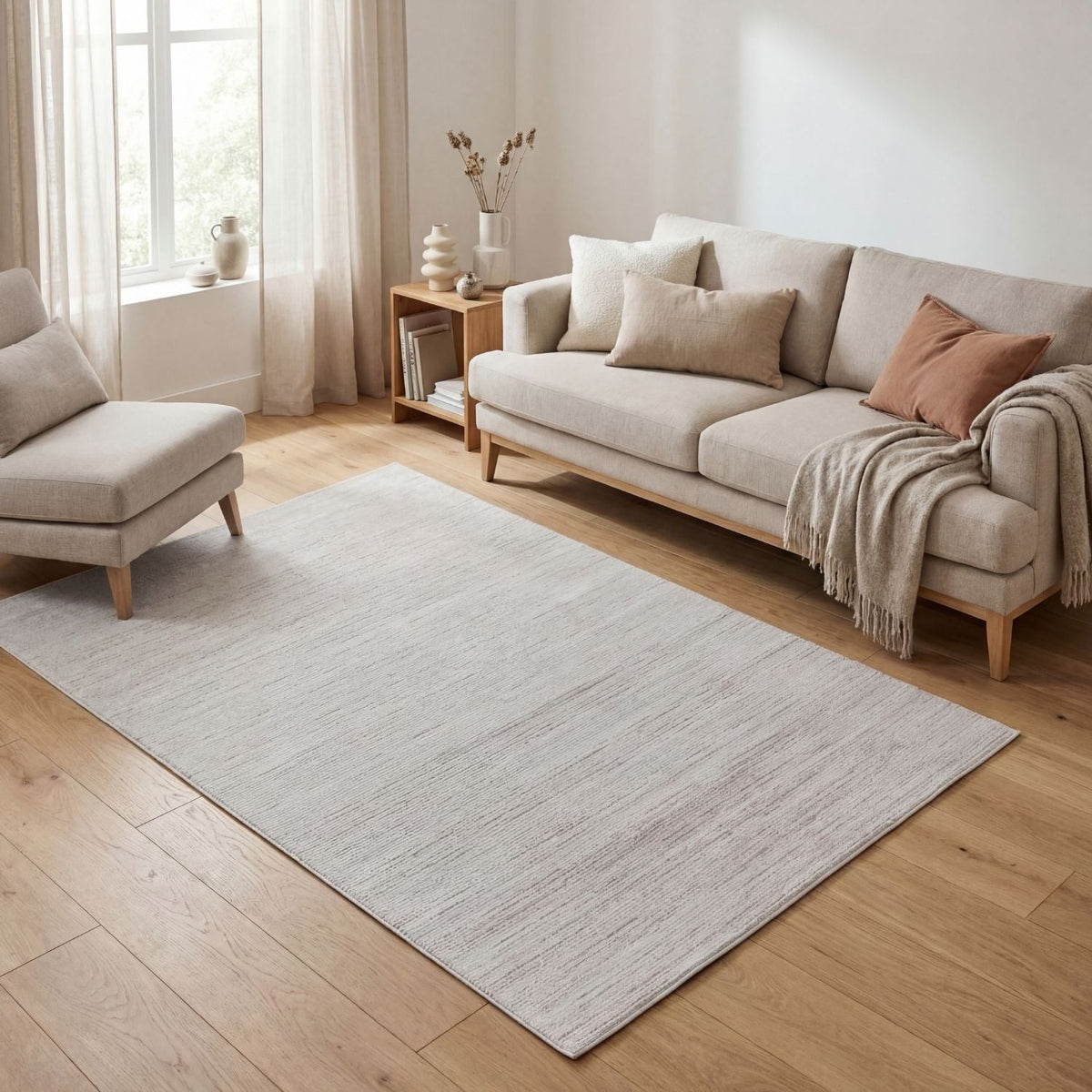 Cream striped rug in a light living room with a sofa