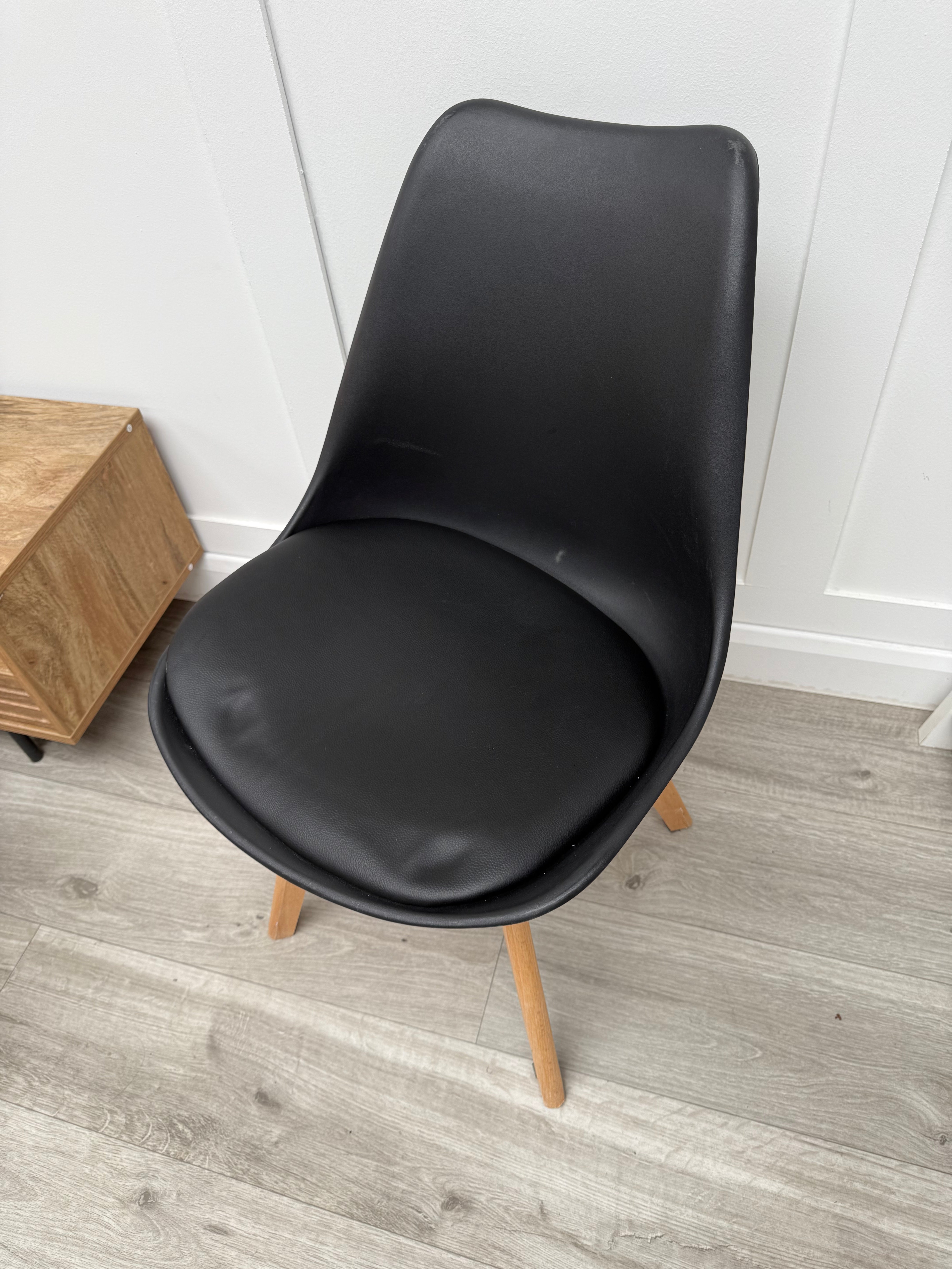 Budget-friendly black plastic dining chair